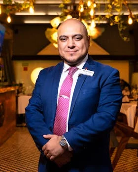 professional male restaurant manager suit