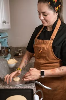 professional female chef preparing fresh ingredients